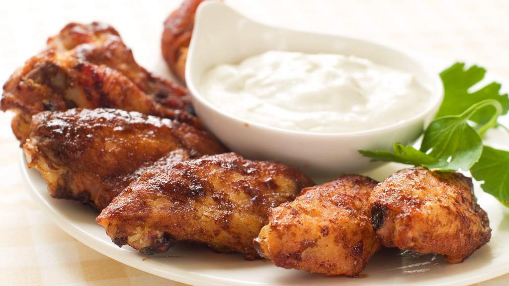Cajun Buffalo Wings · Cajun buffalo special sauce tossed on customer's choice of bone-in or boneless! served with choice of ranch, bleu cheese, BBQ, honey mustard or sweet & sour side sauce!