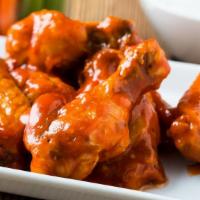 Ranch Buffalo Wings · Ranch Buffalo sauce tossed on wings with customer's choice of bone-in or boneless! Served wi...