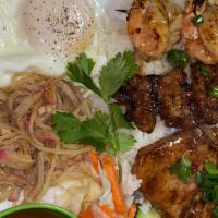 Cơm Đặc Biệt / Special Rice Combo · Grilled honey lemongrass & pork chop, shrimp shredded pork, & pork party egg.