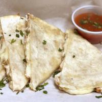 Chicken Quesadilla · Delicious tortilla filled with juicy grilled chicken and Monterey cheese.
