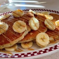 Pb & Banana Pancakes · Baked with peanut butter chips & topped with fresh bananas, drizzled with peanut butter sauce