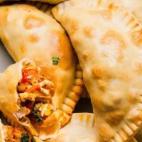 Empanadas Chicken · An empanada is a type of baked or fried turnover consisting of pastry and filling, common in...
