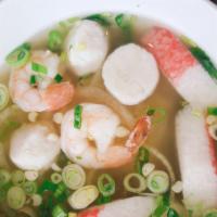 Seafood Pho · Shrimp, calamari, imitation crab, and fish cakes. Rice noodles in a hearty chicken broth top...