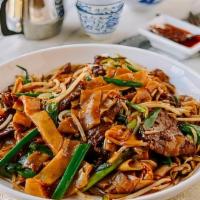 Stir Fried Rice Noodles With Chicken · Bean sprouts and onion in brown sauce.