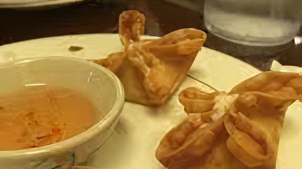 Crab Rangoon · Fried wonton stuffed with crab meat and cream cheese.
