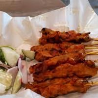Satay · Grilled marinated pork or chicken skewers with house-made peanut sauce. Contains peanut.