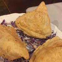 Curry Puff · Deep fried puff pastry stuffed with potato, onions chunk chicken seasoned curry powder serve...