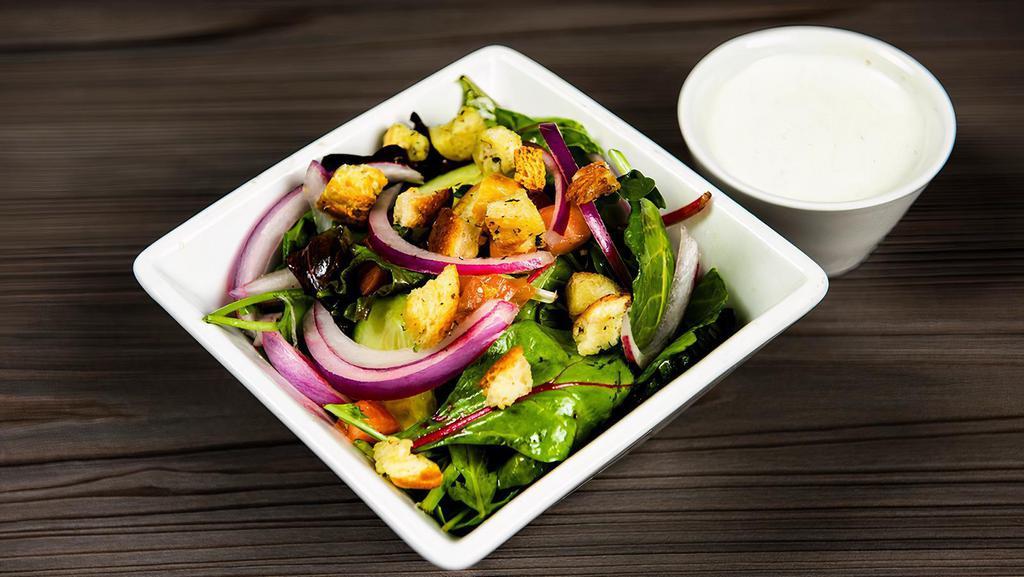 Side House Salad · Mixed field greens with cucumber, red onion, tomato, crushed garlic croutons and your choice of dressing. (Can be Vegan)