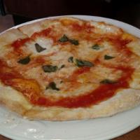 Margherita 10 Inches · Tomato sauce, fresh mozzarella, oregano, and basil topped with olive oil.