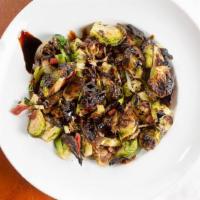 Brussel Sprouts & Prosciutto · Served with garlic, vidalia onions, fennel, thyme, prosciutto and olive oil. Finished with b...