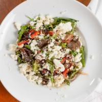Greek Salad · Feta, roasted pepper, black olives, red onion, and roasted mushrooms tossed with field green...