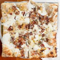 Bacon & Clam Pizza · Roasted garlic cream, clams, maple-smoked bacon, sweet onion, fresh mozzarella, Romano, asia...