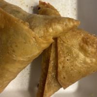 Meat Samosa · Crispy pastry filled with mildly spiced minced lamb.