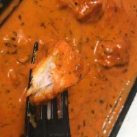 Chicken Tikka Masala · Charcoal roasted chicken cubes in moderately spiced sauce.
