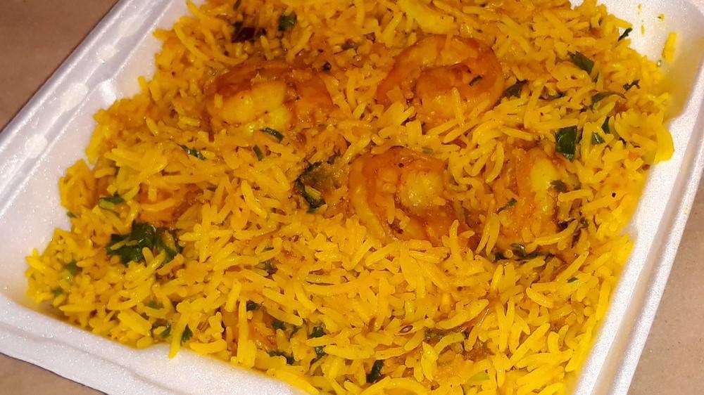 Shrimp Biryani · Basmati rice cooked with shrimp.