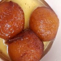 Gulab Jamun · An Indian milk cheese ball, fried and soaked in a honey syrup.