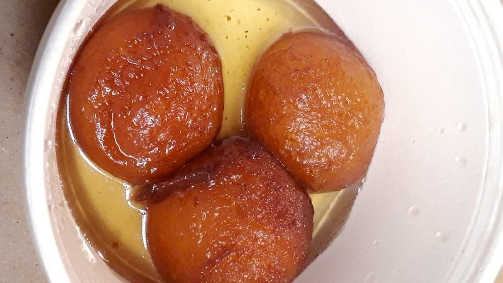 Gulab Jamun · An Indian milk cheese ball, fried and soaked in a honey syrup.