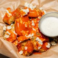 Fried Pickles · Horseradish pickle chips, wing sauce, Bleu cheese crumbles.