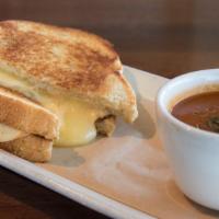 Grown Up Grilled Cheese · Sourdough, sharp Cheddar, American cheese, muenster, tomato basil soup.