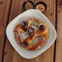 Pub Pretzel · German Style Pretzel topped with Sea Salt. Served with Gochujang Aioli and Spicy Mustard
