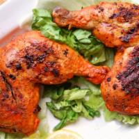 Chicken Tikka Leg & Thigh · Chicken leg and thigh marinated in flavorful mild spices and roasted in the tandoor.