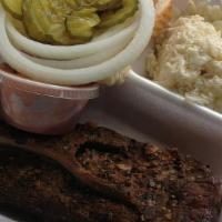 1 Pound Of Meat & 2 Sides · Includes pickles, onions, bread and sauce.