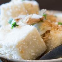 Agedashi Tofu · Deep-fried tofu in ginger dashi broth topped with dried bonito fish flakes.
