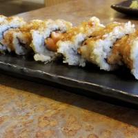 Tempura Seattle Roll · Salmon, avocado, and cream cheese roll deep-fried in tempura batter, topped with eel sauce.