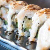 White Tiger Roll · Tempura shrimp with cucumber, topped with white tuna. Torched with parmesan sauce.