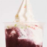 Blueberry Soda Float With Vanilla Ice Cream · Classic vanilla ice cream topped with pop rocks floating on fruit soda