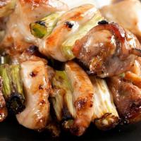 Yakitori · Two pieces of chicken skewers with unagi sauce.
