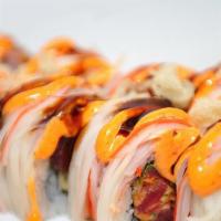 Kani Boy Roll · Spicy crunchy tuna, avocado inside, topped with kani crab meat, spicy mayo and unagi sauce.