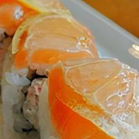 Sake Lemon Roll · crab meat, avocado, Japanese mayo inside, topped with fresh salmon and thin sliced fresh lem...