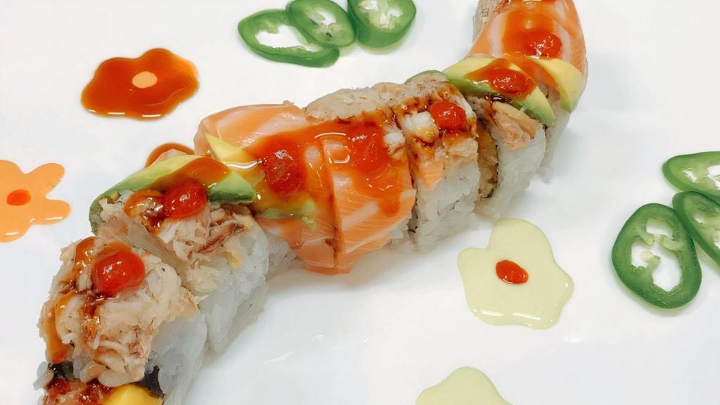 Maryland Roll · Shrimp tempura with sweet mango inside, topped with real crab meat, salmon and avocado, unagi sauce and chili sauce.