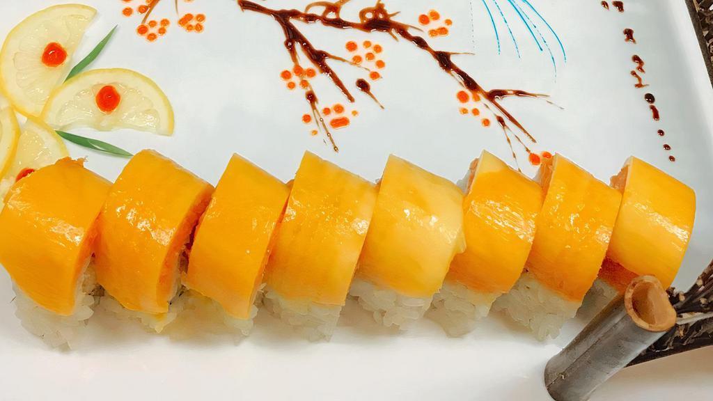 Yellow Angel Roll · Shrimp tempura and cucumber inside, topped with spicy crunchy salmon and sweet mango, spicy mayo and honey wasabi sauce.