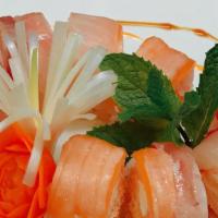 Winners Roll · Tempura salmon with cream cheese wrapped in soybean crepes, topped with red snapper, salmon,...