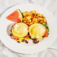 Eggs Benedict · Poached eggs, Canadian bacon, hollandaise - over an English muffin.