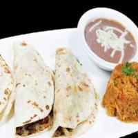 Taco Alambre · Three soft tacos with steak or chicken, onions, green peppers, and melted mozzarella cheese....