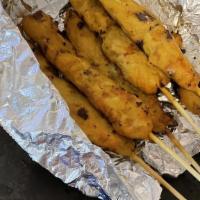 Chicken Satay · Chicken marinated in Thai spices, grilled on a skewer and served with peanut sauce and cucum...