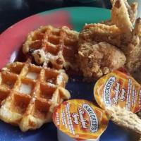 Chicken & Waffle · Our Texas Belgian waffle with four pieces of crispy chicken wings or chicken tenders served ...