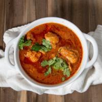 Chicken Curry · Sauce with yogurt, tomatoes, onion, garlic, and ginger in this spicy indian dish.