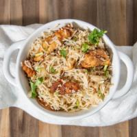 Chicken Biryani · made by layering marinated chicken and then layered with parboiled rice, herbs, saffron milk...