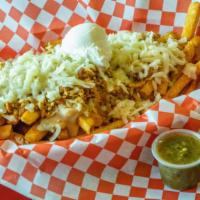 Pollo Fries · Seasoned fries layered with Beans, Chicken and Cheese with a scoop of sour cream and sprinkl...