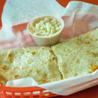 Quesadilla · Flour tortilla, Monterey Jack cheese, chopped chicken and a small side of beans.