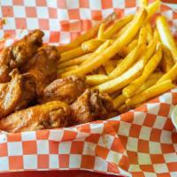 Mild Wings · 7 Wings tossed in our Authentic Mild sauce served with seasoned fries and a ranch dipping sa...