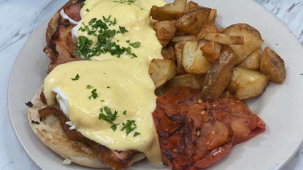 Meeting Street Benedict · Virginia baked ham, poached eggs and house-made hollandaise served . on english muffin with home fries and grilled tomato on the side.