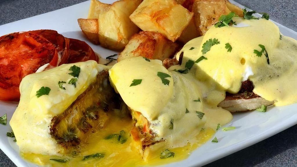 Crab Cake Benedict · HOMEMADE FRIED CRAB PATTIES,POACHED EGGS SERVED ON ENGLISH MUFFIN AND HOLLANDAISE SAUCE WITH HOMEFRIES AND GRILLED TOMATO