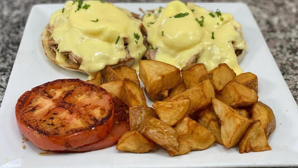 Pulled Pork Benedict · PULLED PORK, POACHED EGGS AND HOLLANDAISE SAUCE SERVED ON ENGLISH MUFFIN WITH HOME FRIES AND GRILLED TOMATO