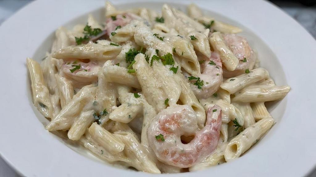 Pasta Alfredo With Shrimp · Homemade creamy Alfredo sauce served on penne pasta with shrimps.