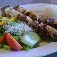 Chicken Kabob · Skewers of natural chicken and vegetables in a special marinade.. Served with rice and side ...